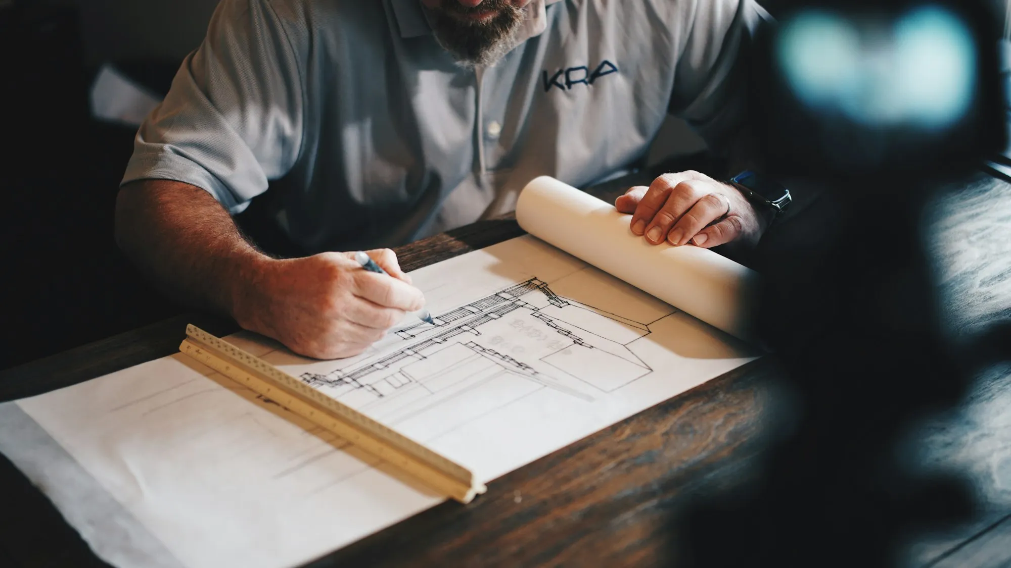An architect drafting hotel plans