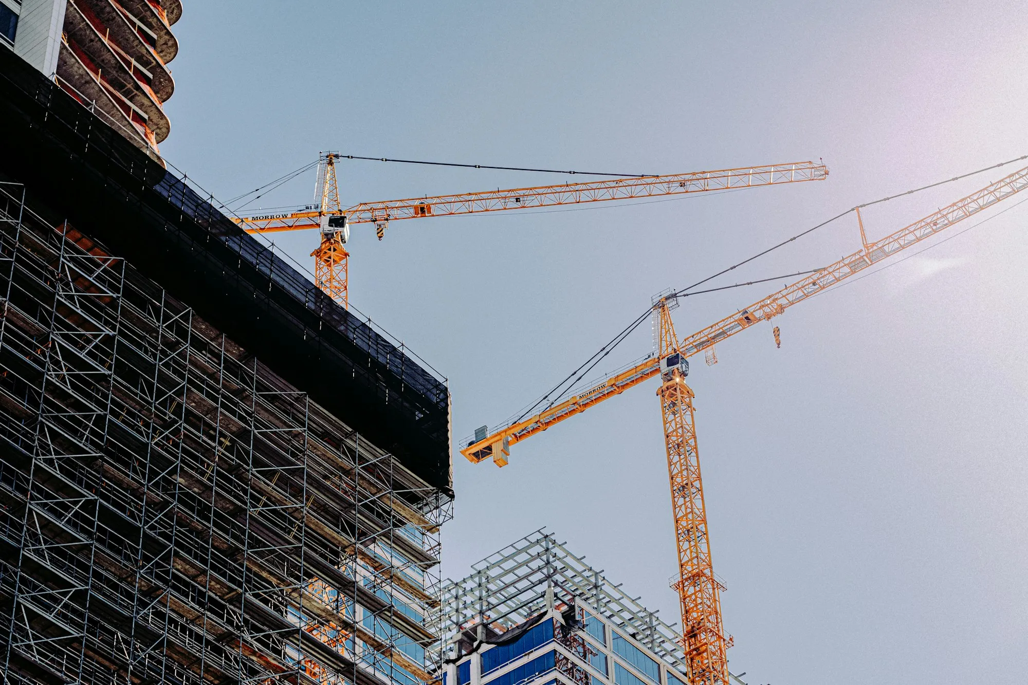 A tower crane over a hotel under construction